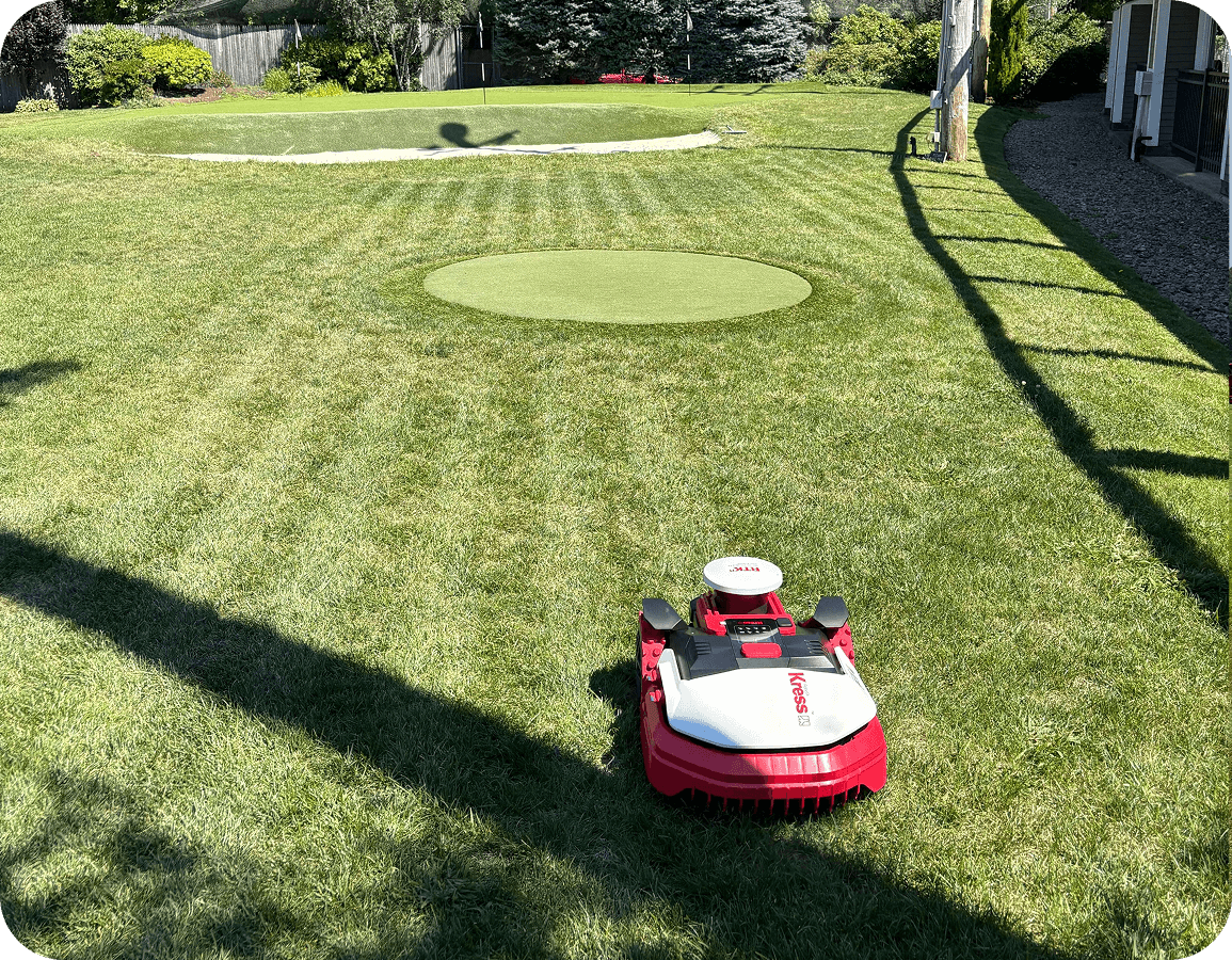 Kress KR282 autonomous mower working on a residential lawn