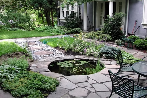 Belmont garden patio with stone path, water feature, and layered planting