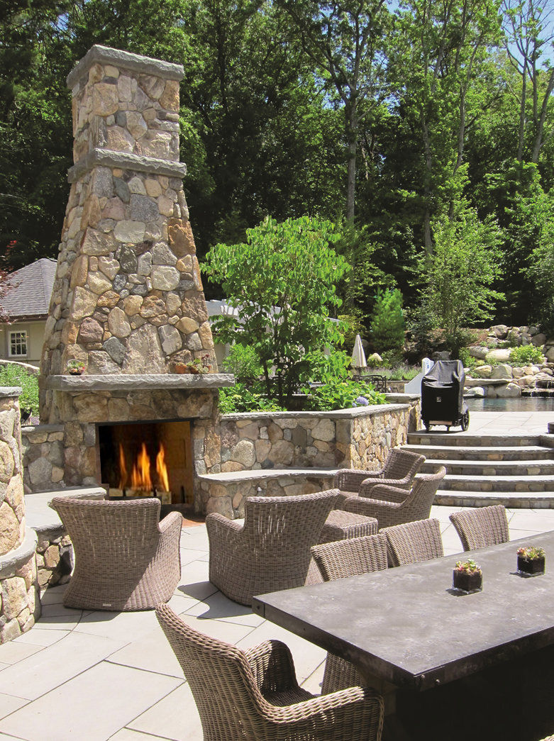 Wellesley Hills Residence - Outdoor fireplace and stone patio